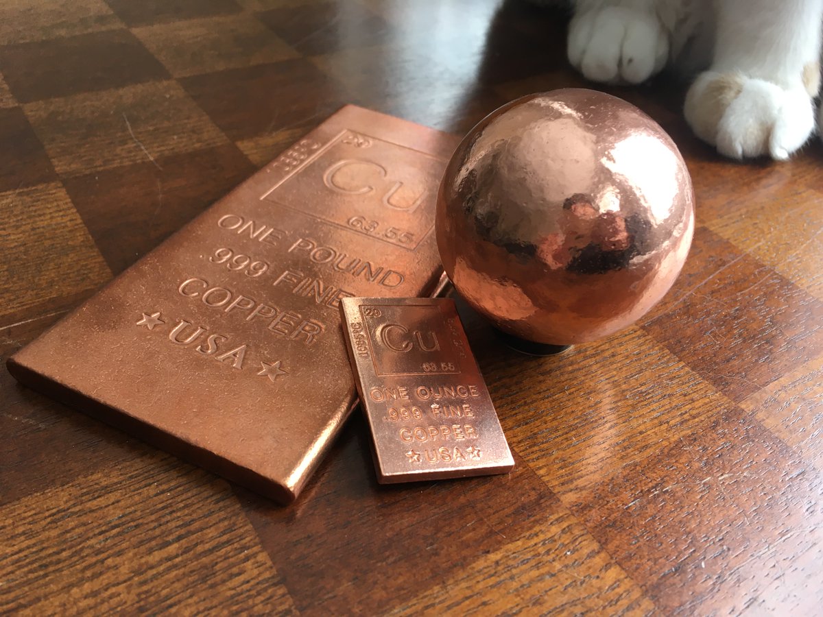 Pure copper, in bars and a sphere.